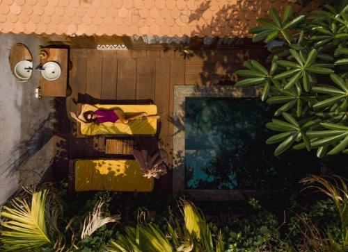 a box of towels on the side of a house at Dontrei Villa Angkor in Siem Reap