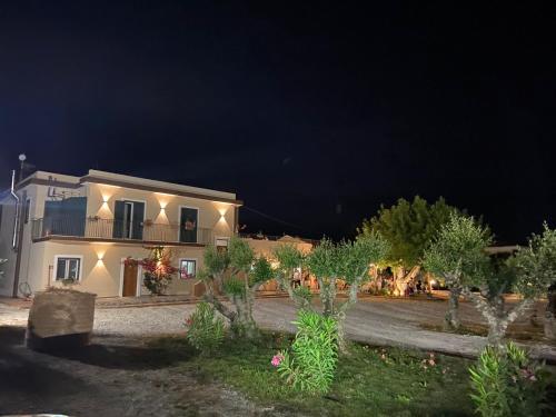 a house at night with trees and lights at B&B Tenuta San Michele in Capaccio-Paestum