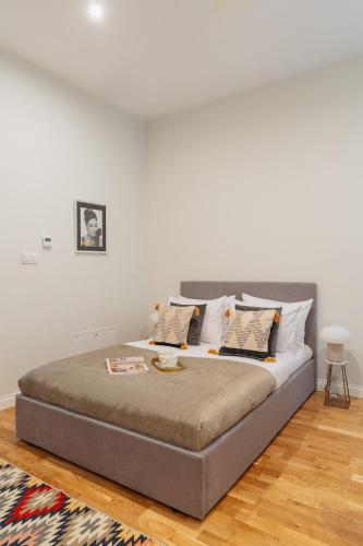 Letto o letti in una camera di Art Palace - LoftAffair Collection