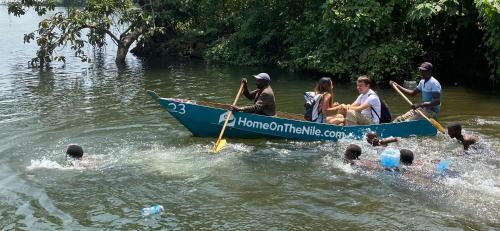 a group of people in a boat in the water at HomeOnTheNile Lake view double in Jinja