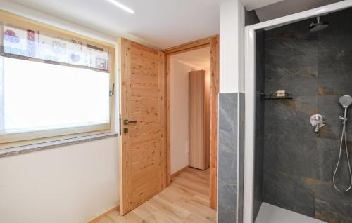 a bathroom with a shower and a glass door at CHALET SIMONETTA - Locanda da Tullio in Capovalle