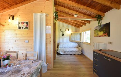 A bed or beds in a room at CHALET SIMONETTA - Locanda da Tullio