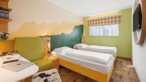 Кровать или кровати в номере Hey Lou Hotel Piding