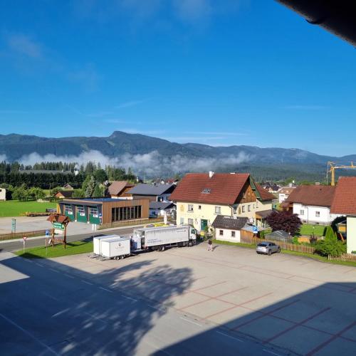 a view of a town with houses and a street at Mountain view apartments in Bad Mitterndorf