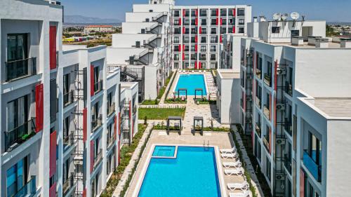 an aerial view of an apartment complex with two swimming pools at C Suites Antalia in Antalya