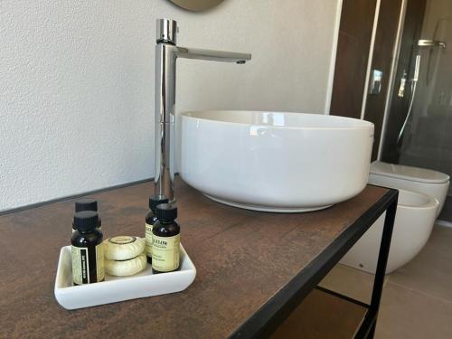 a bathroom counter with a sink and a bowl on it at ATTICO33 in Naples