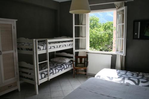 Postel nebo postele na pokoji v ubytování Le Refuge Orezza
