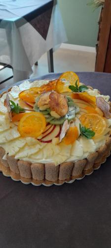 a cake with oranges and other vegetables on a table at B&B Tenuta San Michele in Capaccio-Paestum