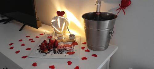a table with a plate of food and a bucket at B&B Tenuta San Michele in Capaccio-Paestum