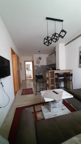 a living room with a couch and a table at Apartments Durmitor in Žabljak