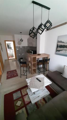 a living room with a couch and a table at Apartments Durmitor in Žabljak