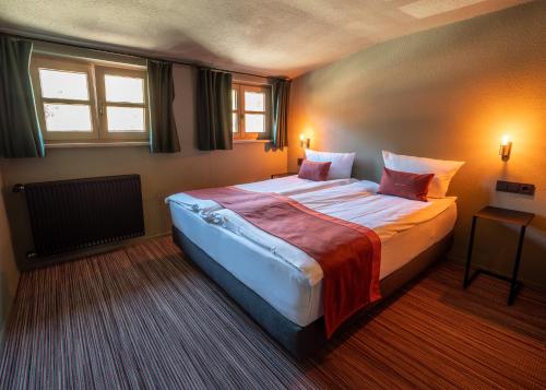 Postel nebo postele na pokoji v ubytování Berghotel Sonnenbichl