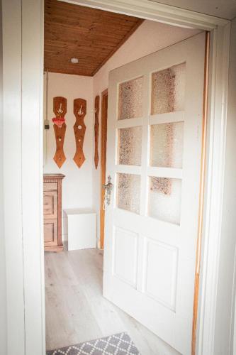 a white door in a room with a counter at Ferienhaus Blick Falkenstein in Lindberg