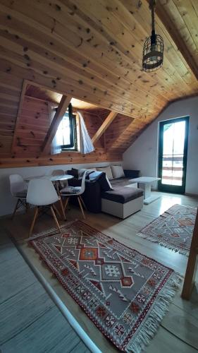 a living room with a couch and a rug at Apartments Durmitor in Žabljak