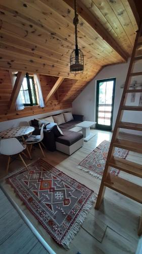 a living room with a couch and a table at Apartments Durmitor in Žabljak