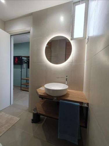 a bathroom with a white sink and a mirror at Playa degli Angeli Levante in Gabicce Mare