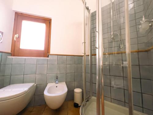 a bathroom with a toilet and a sink and a shower at Residenza Ester in Amalfi