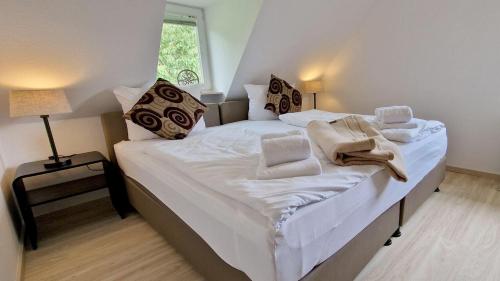 Voodi või voodid majutusasutuse Haus-zum-Leuchtturm-Whg-03 toas