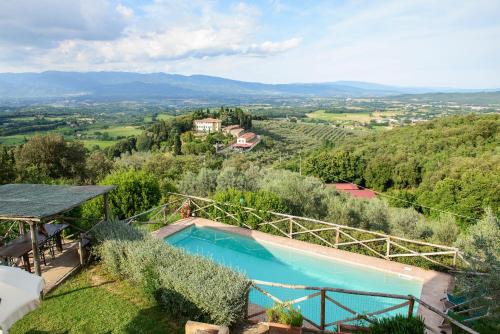 a swimming pool in a villa with a view at Petrolo in Bucine