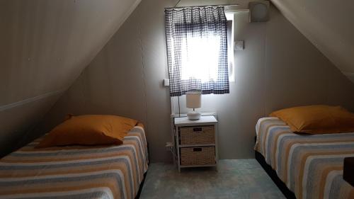 Katil atau katil-katil dalam bilik di COTTAGE - Lac du Causse