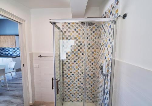 a shower with a glass door in a bathroom at Casa Vacanze Spiaggia Playa in Castellammare del Golfo