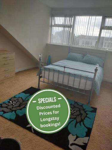 a bedroom with a bed and a rug at Paradise Apartment- Female Only in Bradford
