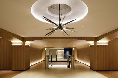 a dining room with a large clock on the ceiling at The Westin Miyako Kyoto in Kyoto
