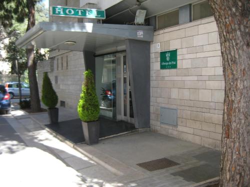 a hotel with a sign on the front of it at Albergo dei Pini in Andria