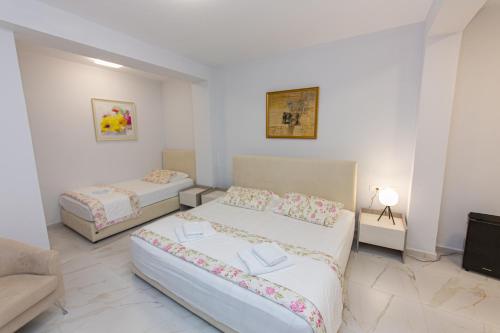 Ένα ή περισσότερα κρεβάτια σε δωμάτιο στο Luxury Villa 2