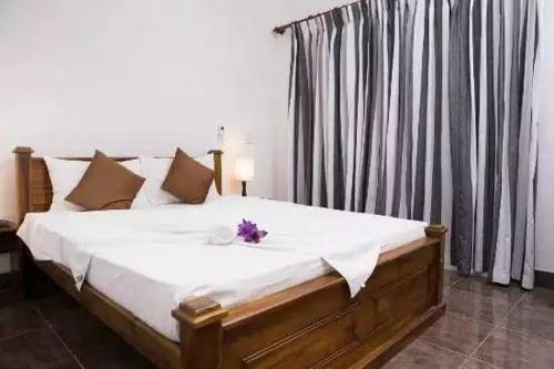Postel nebo postele na pokoji v ubytování Maggona Beach Villa