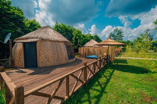 a group of huts on a wooden deck at SAPANCA BAMBOOLOW RESORT in Sakarya