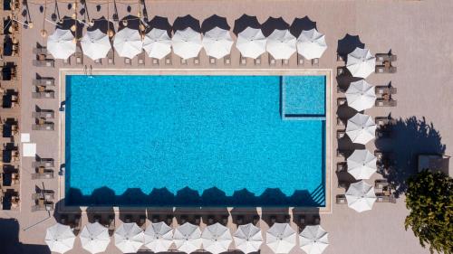 an overhead view of a swimming pool in a resort at Sun Pearl Resort Çeşme in İzmir
