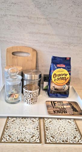 a shelf with a box of food and other items on it at Art Blue Apartments in Ohrid