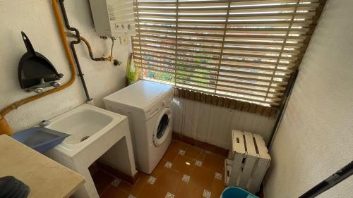 a small bathroom with a toilet and a sink at flat Holiday friend group or family near beach center blasco ibanez in Valencia