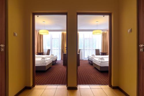 Postel nebo postele na pokoji v ubytování Hotel Podium