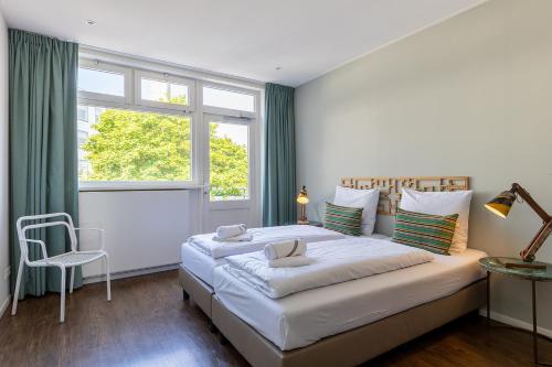 Postel nebo postele na pokoji v ubytování Appartementen Hotel Stad aan Zee Vlissingen