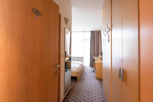 a corridor of a hotel room with a bedroom at Grajski Dvor in Radovljica