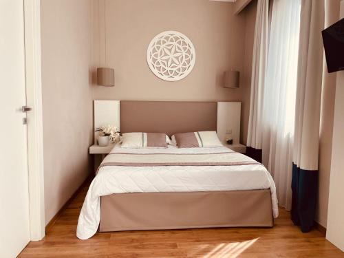 a bedroom with a large bed in a room at Hotel Mediterraneo in Lido di Latina 