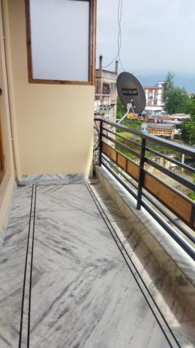 a view from the balcony of a house at Hotel CM Palace - Pure Vegetarian in Ner Chowk