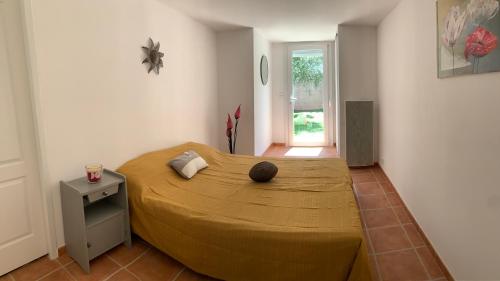 a bedroom with a large bed in a room at Location saisonnière in Béziers