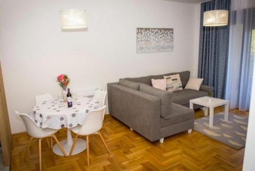 a living room with a couch and a table at Apartman NOA EXCLUSIVE in Trebinje