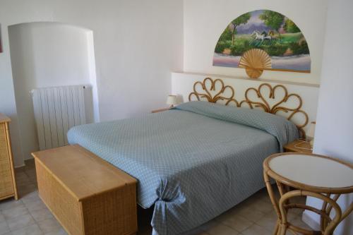 Postel nebo postele na pokoji v ubytování Hotel Scoglio Bianco
