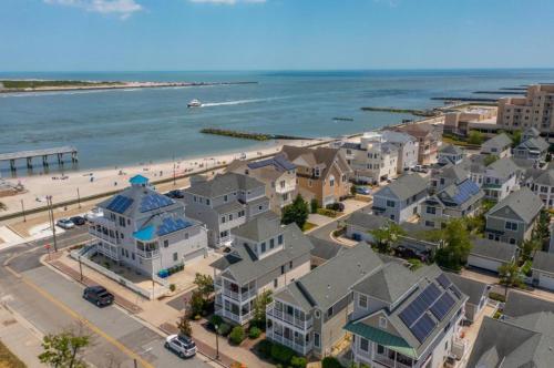 an aerial view of a beach with houses and the ocean at AMAZING!!!! Luxury 5BR, Steps to beach and Fun! Fully Renovated Beach house! in Atlantic City