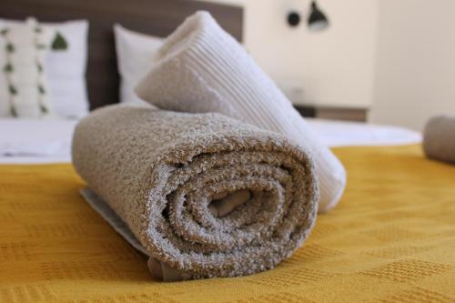 a towel sitting on top of a bed at House Štefanac in Seliste Dreznicko