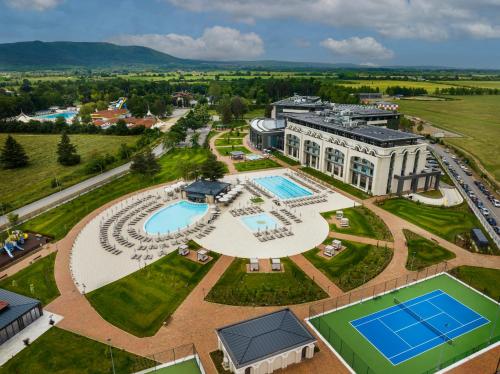 an aerial view of a building with a tennis court at Kings' Valley Medical & Spa Hotel in Kazanlŭk