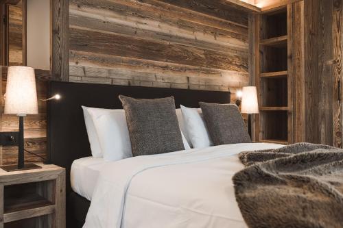 Postel nebo postele na pokoji v ubytování Hotel Alù Mountain Design