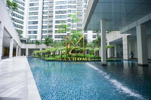 a swimming pool in the middle of a building at Maxhome@Regalia suite residence. KL in Kuala Lumpur