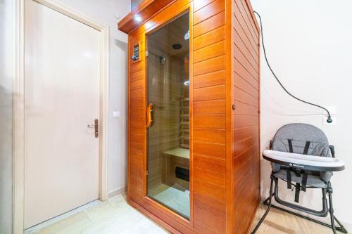 a bathroom with a toilet and a sink and a mirror at Giourgas house in Chlomatianá