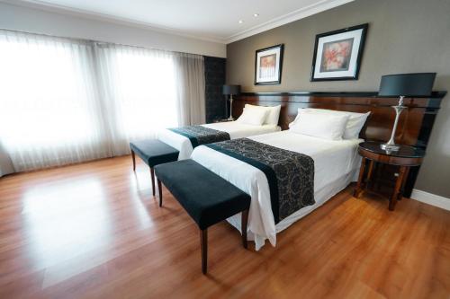 Una cama o camas en una habitación de Amérian Executive Córdoba