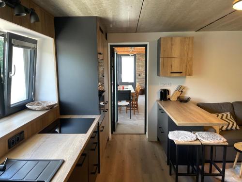 a kitchen and living room in a tiny house at Jirotovy boudy I in Telnice